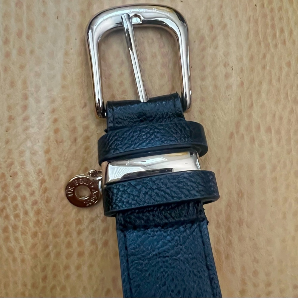 Polo black belt with gold trim and circular Logo. M 44in